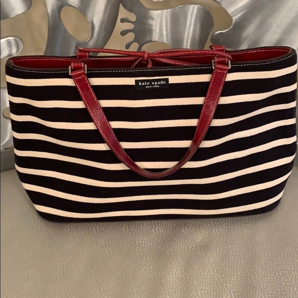Kate Spade New York Black and White Striped Tote with Red Leather Trim.
